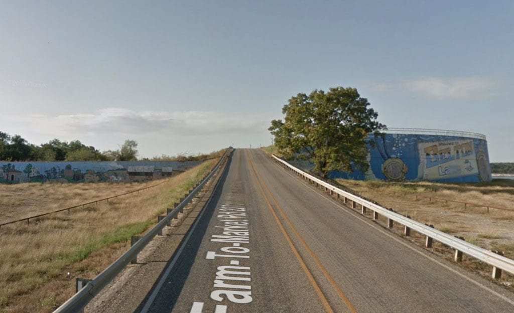Belton Dam Mural Now via Google Maps shows a long road stretched out.
