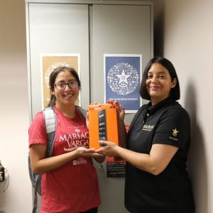 Student Sofia Gonzalez accepts her Amazon Fire HD8 tablet prize.