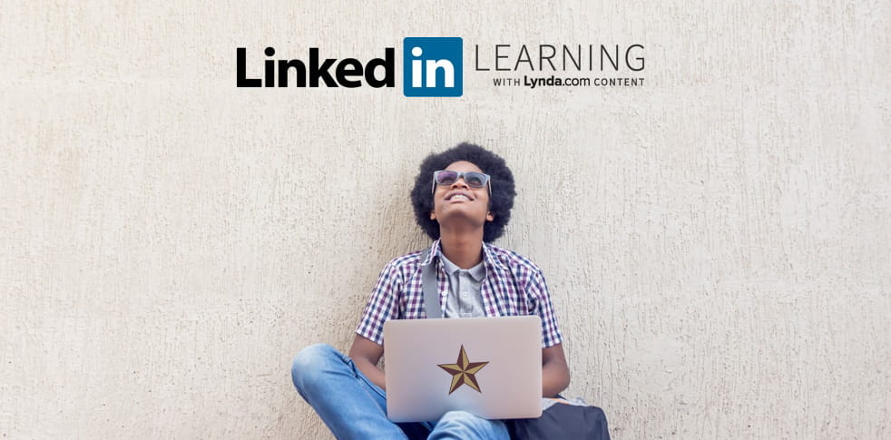 Man sites on floor and stares up at LinkedIn Learning logo.