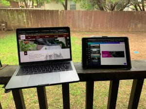 Image of laptop and iPad outdoors